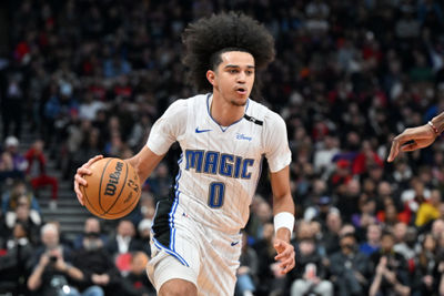 Jan 21, 2025; Toronto, Ontario, CAN; Orlando Magic guard Anthony Black (0) dribbles against the Toronto Raptors in the first half at Scotiabank Arena. Mandatory Credit: Dan Hamilton-Imagn Images