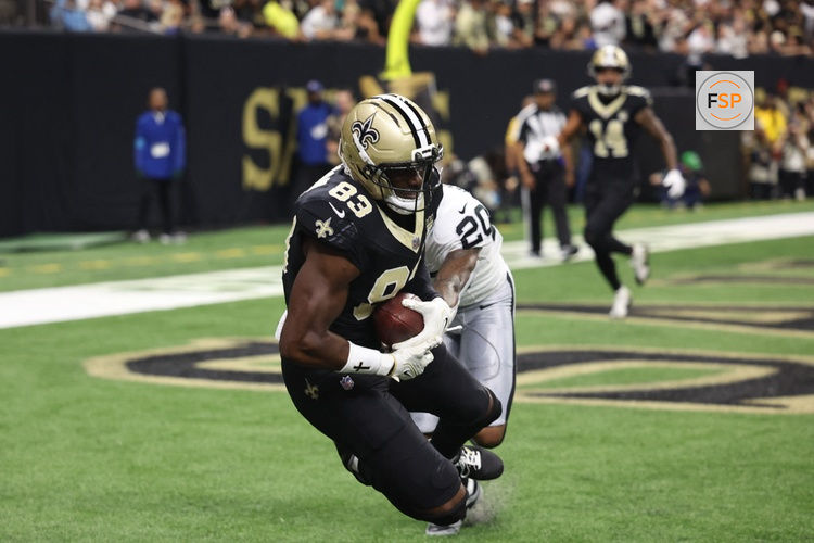 Sep 27, 2026; New Orleans, Louisiana, USA;  New Orleans Saints tight end Juwan Johnson (83) cathces the ball for a touchdown in the first quarter against the Las Vegas Raiders at Caesars Superdome.  Credit: Stephen Lew-Imagn Images