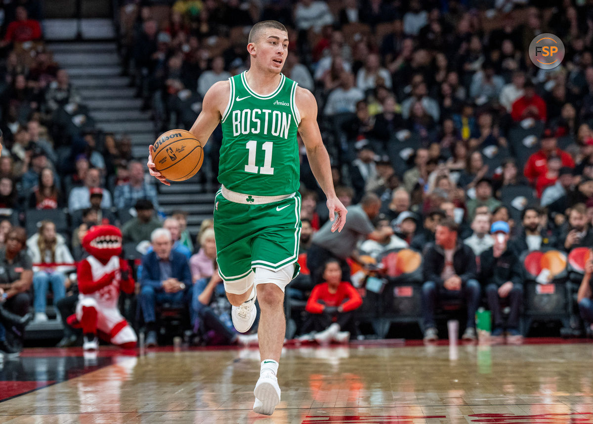 Oct 15, 2024; Toronto, Ontario, CAN; Boston Celtics guard Payton Pritchard (11) dribbles the ball against the Toronto Raptors during the first half at Scotiabank Arena. Credit: Kevin Sousa-Imagn Images