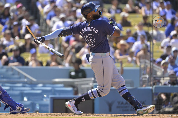 Aug 25, 2024; Los Angeles, California, USA;  Tampa Bay Rays third baseman Junior Caminero (13) breaks his bat on a ground out in the eighth inning against the Los Angeles Dodgers at Dodger Stadium. Credit: Jayne Kamin-Oncea-USA TODAY Sports