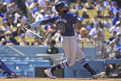 Aug 25, 2024; Los Angeles, California, USA;  Tampa Bay Rays third baseman Junior Caminero (13) breaks his bat on a ground out in the eighth inning against the Los Angeles Dodgers at Dodger Stadium. Mandatory Credit: Jayne Kamin-Oncea-USA TODAY Sports