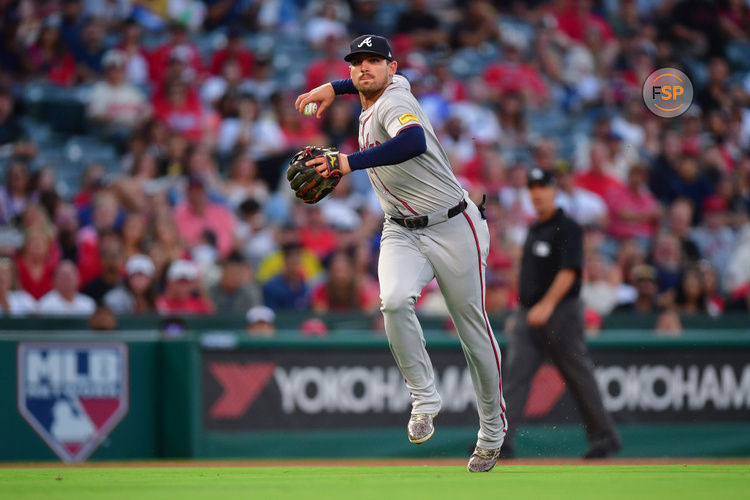 August 16, 2024; Anaheim, California, USA; Atlanta Braves third baseman Austin Riley (27) throws to first for the out against Los Angeles Angels shortstop Zach Neto (9) during the third inning at Angel Stadium. Credit: Gary A. Vasquez-USA TODAY Sports