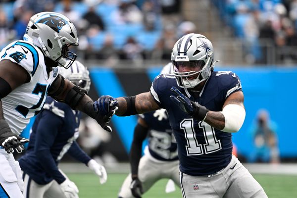 Dec 15, 2024; Charlotte, North Carolina, USA;  Dallas Cowboys linebacker Micah Parsons (11) rushes as Carolina Panthers offensive tackle Taylor Moton (72) defends in the first quarter at Bank of America Stadium. Mandatory Credit: Bob Donnan-Imagn Images
