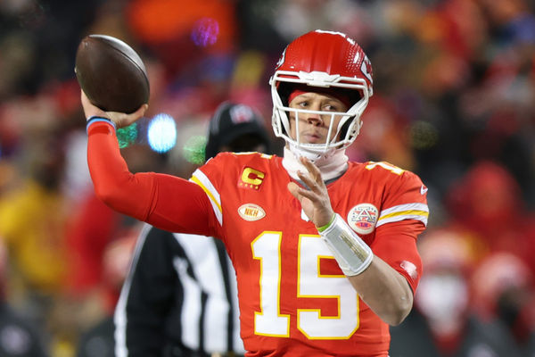 KANSAS CITY, MO - JANUARY 13: Kansas City Chiefs quarterback Patrick Mahomes (15) throws an 11-yard touchdown pass in the first quarter of an AFC Wild Card playoff game between the Miami Dolphins and Kansas City Chiefs on Jan 13, 2024 at GEHA Field at Arrowhead Stadium in Kansas City, MO. (Photo by Scott Winters/Icon Sportswire)