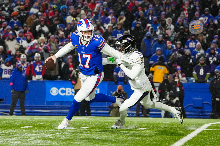 Jan 19, 2025; Orchard Park, New York, USA; Buffalo Bills quarterback Josh Allen (17) avoids a tackle from Baltimore Ravens cornerback Nate Wiggins (2) during the third quarter in a 2025 AFC divisional round game at Highmark Stadium. Credit: Gregory Fisher-Imagn Images