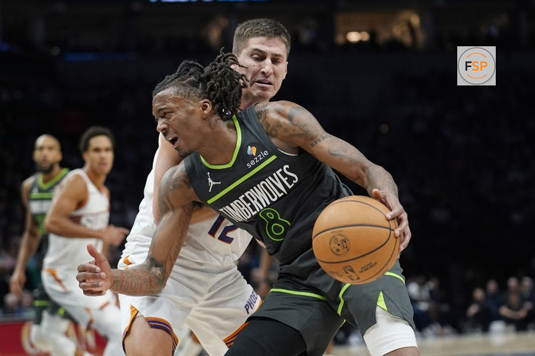 Mar 17, 2026; Minneapolis, Minnesota, USA; Minnesota Timberwolves guard Bones Hyland (8) works around Phoenix Suns guard Collin Gillespie (12) in the fourth quarter at Target Center. Credit: Bruce Kluckhohn-Imagn Images