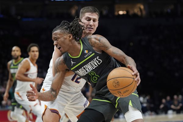 Mar 17, 2026; Minneapolis, Minnesota, USA; Minnesota Timberwolves guard Bones Hyland (8) works around Phoenix Suns guard Collin Gillespie (12) in the fourth quarter at Target Center. Mandatory Credit: Bruce Kluckhohn-Imagn Images