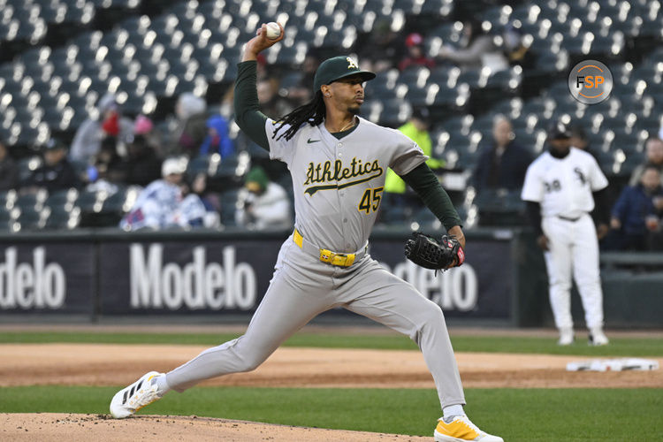 Apr 16, 2025; Chicago, Illinois, USA;  Athletics pitcher Osvaldo Bido (45) delivers during the first inning against the Chicago White Sox at Rate Field. Credit: Matt Marton-Imagn Images