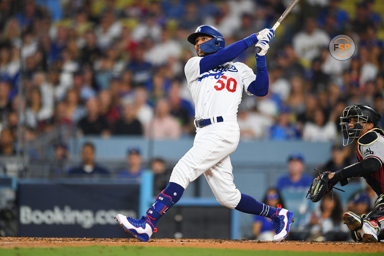 LOS ANGELES, CA - OCTOBER 07: Los Angeles Dodgers second baseman Mookie Betts (50) swings at a pitch during the MLB NLDS Game 1 between the Arizona Diamondbacks and the Los Angeles Dodgers on October 7, 2023 at Dodger Stadium in Los Angeles, CA. (Photo by Brian Rothmuller/Icon Sportswire)