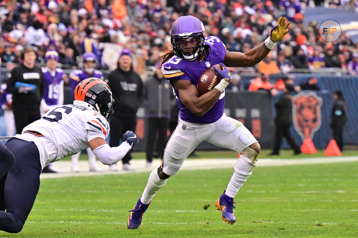 Nov 24, 2024; Chicago, Illinois, USA; Minnesota Vikings running back Aaron Jones (33) runs after a catch against the Chicago Bears during the third quarter at Soldier Field. Credit: Daniel Bartel-Imagn Images