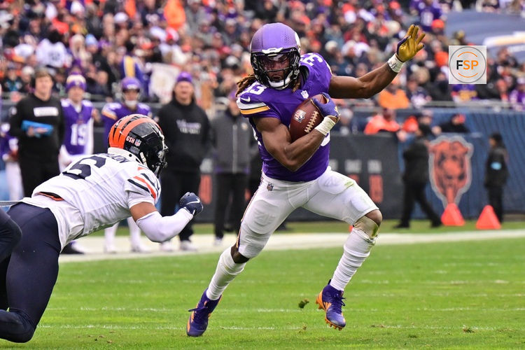 Nov 24, 2024; Chicago, Illinois, USA; Minnesota Vikings running back Aaron Jones (33) runs after a catch against the Chicago Bears during the third quarter at Soldier Field. Credit: Daniel Bartel-Imagn Images