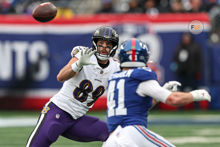 Dec 15, 2024; East Rutherford, New Jersey, USA; Baltimore Ravens tight end Mark Andrews (89) makes a catch during the first half in front of New York Giants linebacker Micah McFadden (41) at MetLife Stadium. Credit: Vincent Carchietta-Imagn Images