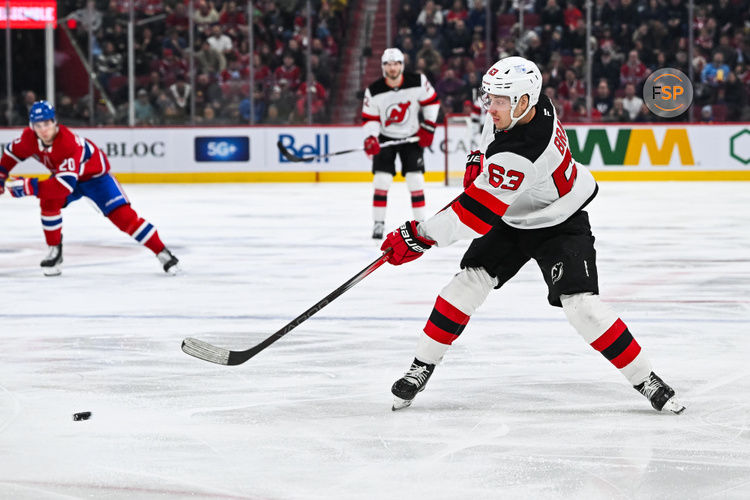 Feb 8, 2025; Montreal, Quebec, CAN; New Jersey Devils left wing Jesper Bratt (63) shoots the puck against the Montreal Canadiens during the first period at Bell Centre. Credit: David Kirouac-Imagn Images