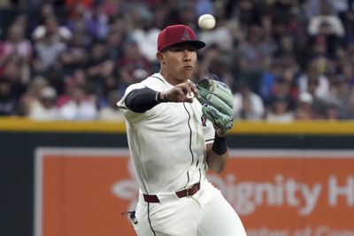 Mar 31, 2026; Phoenix, Arizona, USA; Arizona Diamondbacks third baseman Jose Fernandez (11) makes the off balance throw for an out against the Detroit Tigers in the first inning at Chase Field. Mandatory Credit: Rick Scuteri-Imagn Images