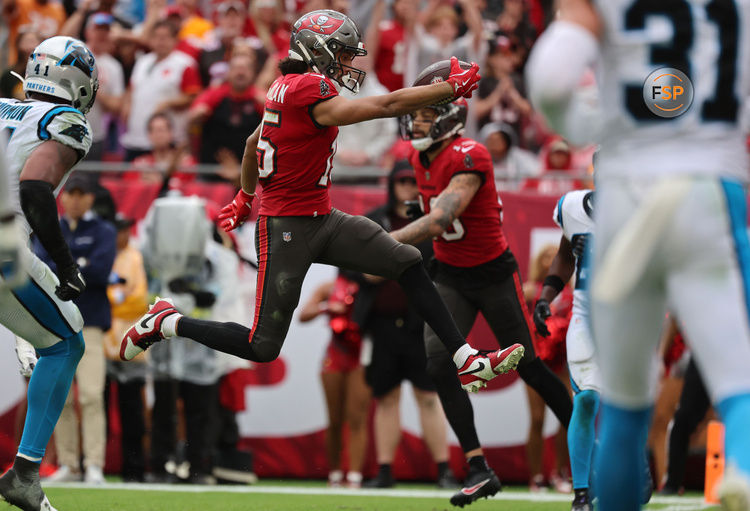 Dec 29, 2024; Tampa, Florida, USA;Tampa Bay Buccaneers wide receiver Jalen McMillan (15) runs the ball in for a touchdown  against the Carolina Panthers  during the second half at Raymond James Stadium. Credit: Kim Klement Neitzel-Imagn Images