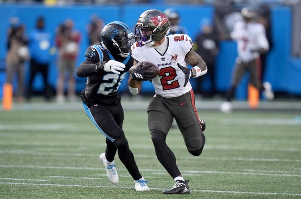 Dec 21, 2025; Charlotte, North Carolina, USA; Tampa Bay Buccaneers wide receiver Emeka Egbuka (2) runs against Carolina Panthers safety Nick Scott (21) during the second half at Bank of America Stadium. Mandatory Credit: Jim Dedmon-Imagn Images