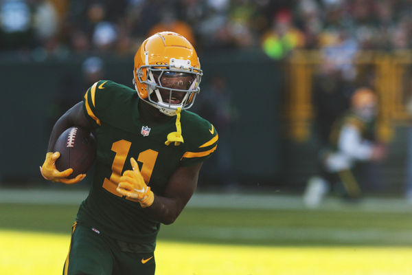 GREEN BAY, WI - NOVEMBER 19: Green Bay Packers wide receiver Jayden Reed (11) scores a touchdown during game between the Green Bay Packers and the Los Angeles Chargers at Lambeau Field on November 19, 2023 in Green Bay, WI. (Photo by Larry Radloff/Icon Sportswire)