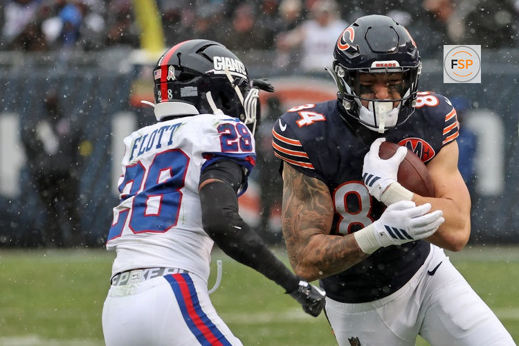 Nov 9, 2025; Chicago, Illinois, USA; Chicago Bears tight end Colston Loveland (84) makes a catch over New York Giants cornerback Cordale Flott (28) during the second half at Soldier Field. Credit: Mike Dinovo-Imagn Images