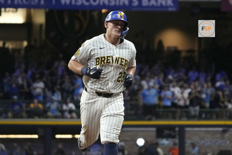 Jul 26, 2025; Milwaukee, Wisconsin, USA; Milwaukee Brewers first base Andrew Vaughn (28) rounds the bases after hitting a home runa aigainst the Miami Marlins in the ninth inning at American Family Field. Credit: Michael McLoone-Imagn Images