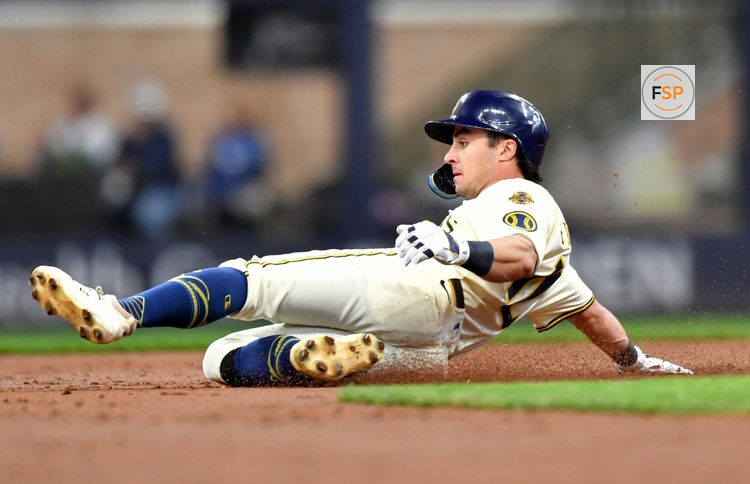 May 28, 2025; Milwaukee, Wisconsin, USA; Milwaukee Brewers right fielder Sal Frelick (10) slides into second base during the second inning against the Boston Red Sox at American Family Field. Credit: Patrick Gorski-Imagn Images
