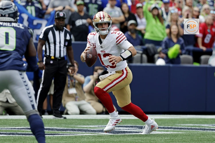Sep 7, 2025; Seattle, Washington, USA; San Francisco 49ers quarterback Brock Purdy (13) run the ball during the first half against the Seattle Seahawks at Lumen Field. Credit: Joe Nicholson-Imagn Images