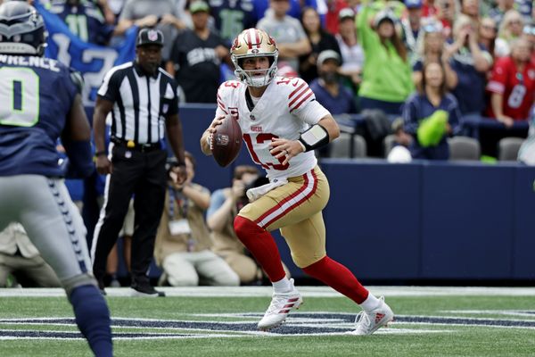 Sep 7, 2025; Seattle, Washington, USA; San Francisco 49ers quarterback Brock Purdy (13) run the ball during the first half against the Seattle Seahawks at Lumen Field. Mandatory Credit: Joe Nicholson-Imagn Images