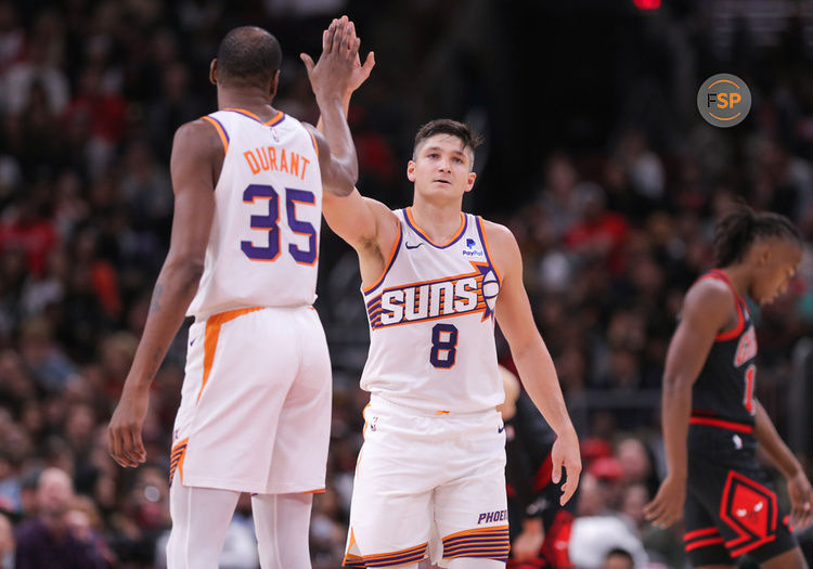 CHICAGO, IL - NOVEMBER 08: Grayson Allen #8 of the Phoenix Suns high fives Kevin Durant #35 of the Phoenix Suns after making a 3-point basket during the second half against the Chicago Bulls at the United Center on November 8, 2023 in Chicago, Illinois. (Photo by Melissa Tamez/Icon Sportswire)