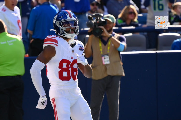 Oct 6, 2024; Seattle, Washington, USA; New York Giants wide receiver Darius Slayton (86) celebrates after scoring a touchdown against the Seattle Seahawks during the second half at Lumen Field. Credit: Steven Bisig-Imagn Images