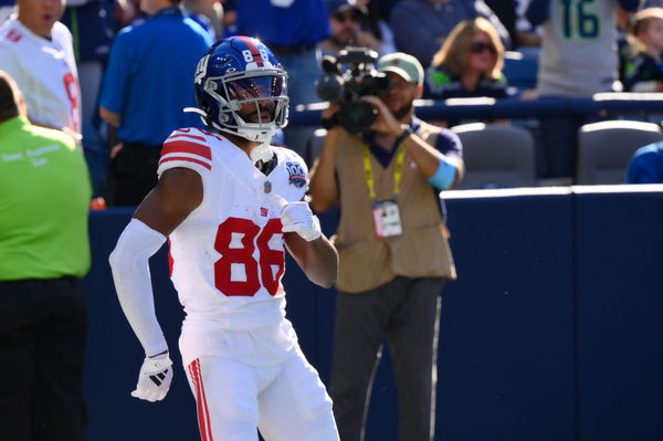 Oct 6, 2024; Seattle, Washington, USA; New York Giants wide receiver Darius Slayton (86) celebrates after scoring a touchdown against the Seattle Seahawks during the second half at Lumen Field. Mandatory Credit: Steven Bisig-Imagn Images