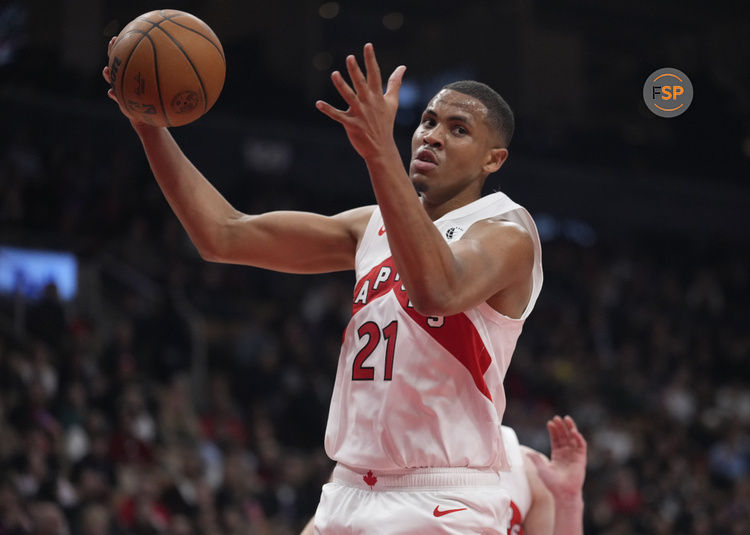 Mar 10, 2025; Toronto, Ontario, CAN; Toronto Raptors center Orlando Robinson (21) comes down with a rebound against the Washington Wizards during the first half at Scotiabank Arena. Credit: John E. Sokolowski-Imagn Images