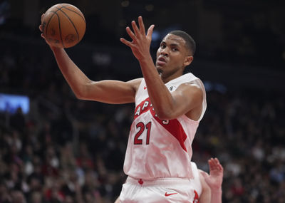 Mar 10, 2025; Toronto, Ontario, CAN; Toronto Raptors center Orlando Robinson (21) comes down with a rebound against the Washington Wizards during the first half at Scotiabank Arena. Mandatory Credit: John E. Sokolowski-Imagn Images