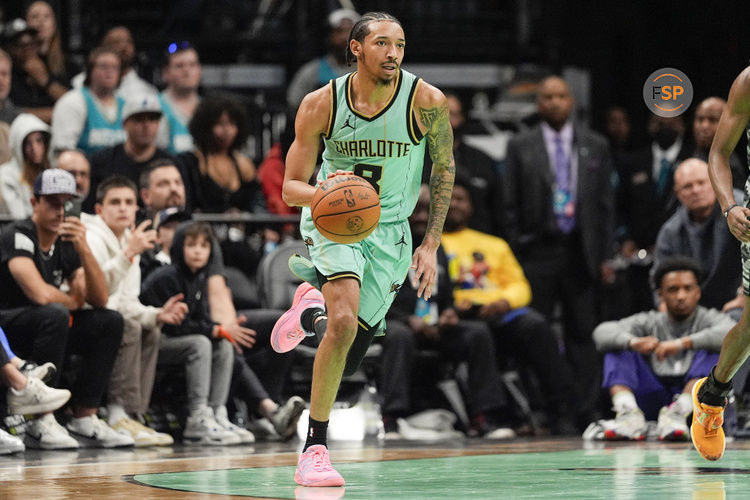 Feb 7, 2025; Charlotte, North Carolina, USA; Charlotte Hornets guard Nick Smith Jr. (8) brings the ball up court against the San Antonio Spurs during the second half at Spectrum Center. Credit: Jim Dedmon-Imagn Images