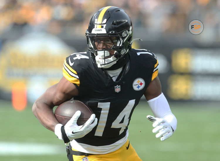 Nov 17, 2024; Pittsburgh, Pennsylvania, USA;  Pittsburgh Steelers wide receiver George Pickens (14) runs after a  catch against the Baltimore Ravens during the first quarter at Acrisure Stadium. Credit: Charles LeClaire-Imagn Images