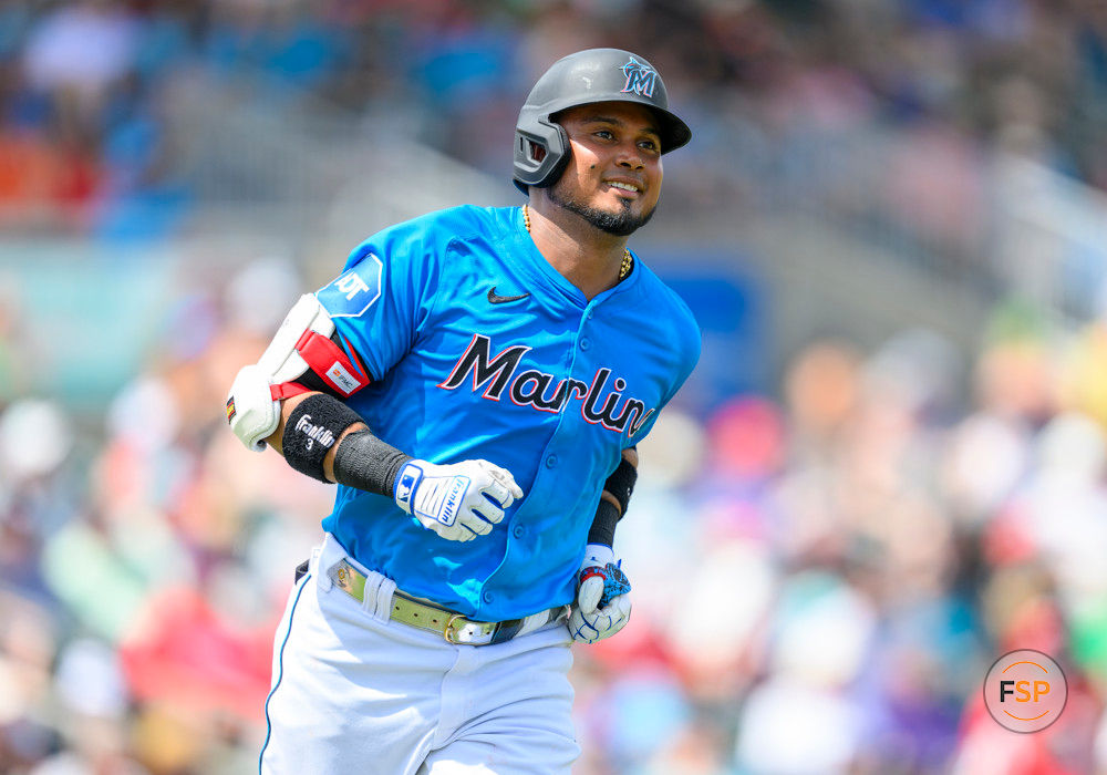 JUPITER, FL - MARCH 16: Miami Marlins infielder Luis Arraez (3) smiles as he runs to first base after batting during an MLB spring training game between the Philadelphia Phillies and the Miami Marlins at the Roger Dean Chevrolet Stadium on March 16, 2024 in Jupiter, Florida. (Photo by Doug Murray/Icon Sportswire)