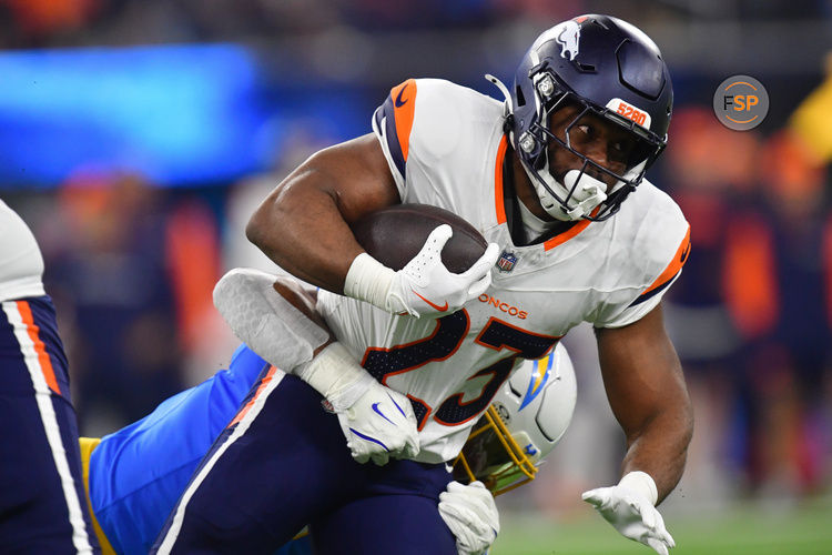 Dec 19, 2024; Inglewood, California, USA; Denver Broncos running back Audric Estime (23) runs the ball against the Los Angeles Chargers during the first half at SoFi Stadium. Credit: Gary A. Vasquez-Imagn Images