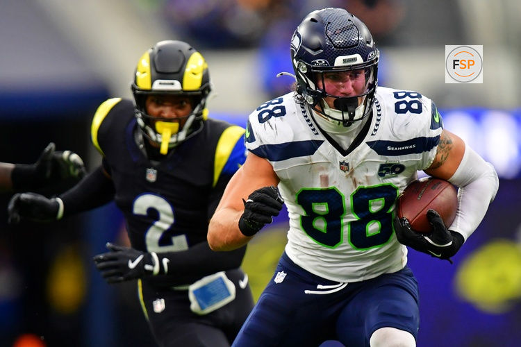 Nov 16, 2025; Inglewood, California, USA; Seattle Seahawks tight end AJ Barner (88) runs with the ball during the second half against the Los Angeles Rams at SoFi Stadium. Credit: Gary A. Vasquez-Imagn Images