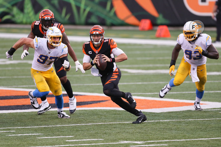 CINCINNATI, OH - SEPTEMBER 13: Cincinnati Bengals quarterback Joe Burrow (9) looks to pass with Los Angeles Chargers defensive end Joey Bosa (97) chasing during the game against the Los Angeles Chargers and the Cincinnati Bengals on September 13, 2020, at Paul Brown Stadium in Cincinnati, OH. (Photo by Ian Johnson/Icon Sportswire)