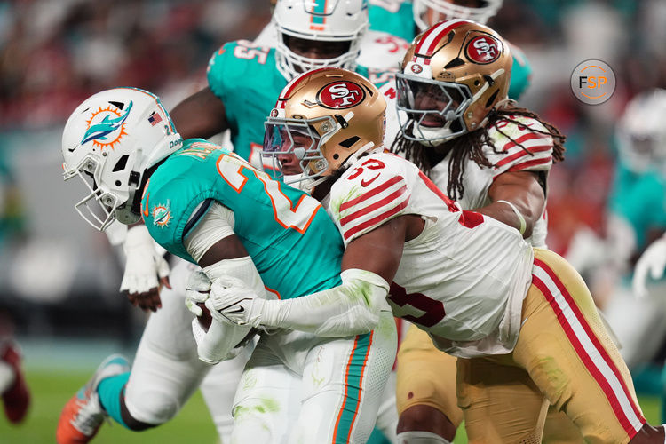 Dec 22, 2024; Miami Gardens, Florida, USA; San Francisco 49ers linebacker Dee Winters (53) tackles Miami Dolphins running back De'Von Achane (28) during second half at Hard Rock Stadium. Credit: Jasen Vinlove-Imagn Images