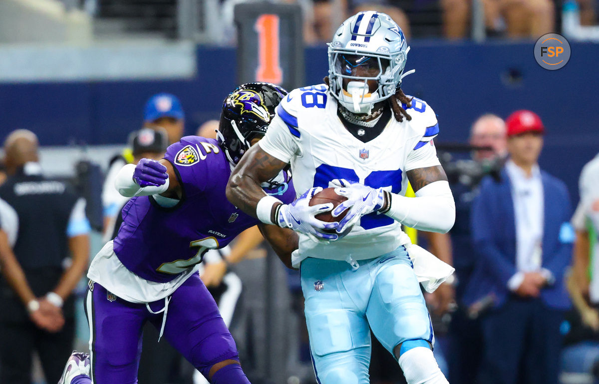 Sep 22, 2024; Arlington, Texas, USA;  Dallas Cowboys wide receiver CeeDee Lamb (88) runs with the ball as Baltimore Ravens cornerback Nate Wiggins (2) defends during the first half at AT&T Stadium. Credit: Kevin Jairaj-Imagn Images