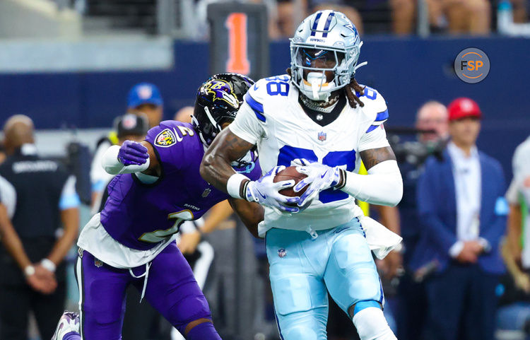 Sep 22, 2024; Arlington, Texas, USA;  Dallas Cowboys wide receiver CeeDee Lamb (88) runs with the ball as Baltimore Ravens cornerback Nate Wiggins (2) defends during the first half at AT&T Stadium. Credit: Kevin Jairaj-Imagn Images