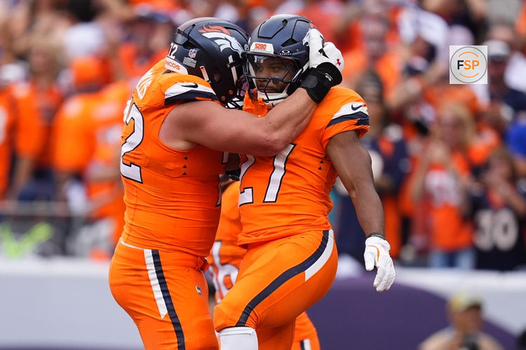 Sep 7, 2025; Denver, Colorado, USA; Denver Broncos running back J.K. Dobbins (27) reacts after scoring a touchdown against the Tennessee Titans in the second half at Empower Field at Mile High. Credit: Ron Chenoy-Imagn Images