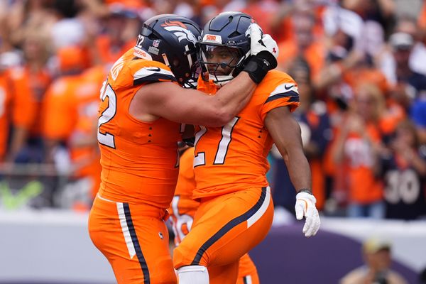 Sep 7, 2025; Denver, Colorado, USA; Denver Broncos running back J.K. Dobbins (27) reacts after scoring a touchdown against the Tennessee Titans in the second half at Empower Field at Mile High. Mandatory Credit: Ron Chenoy-Imagn Images