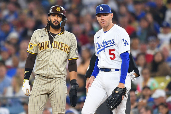 LOS ANGELES, CA - SEPTEMBER 13: San Diego Padres right fielder Fernando Tatis Jr. (23) looks on with Los Angeles Dodgers first baseman Freddie Freeman (5) during the MLB game between the San Diego Padres and the Los Angeles Dodgers on September 13, 2023 at Dodger Stadium in Los Angeles, CA. (Photo by Brian Rothmuller/Icon Sportswire)