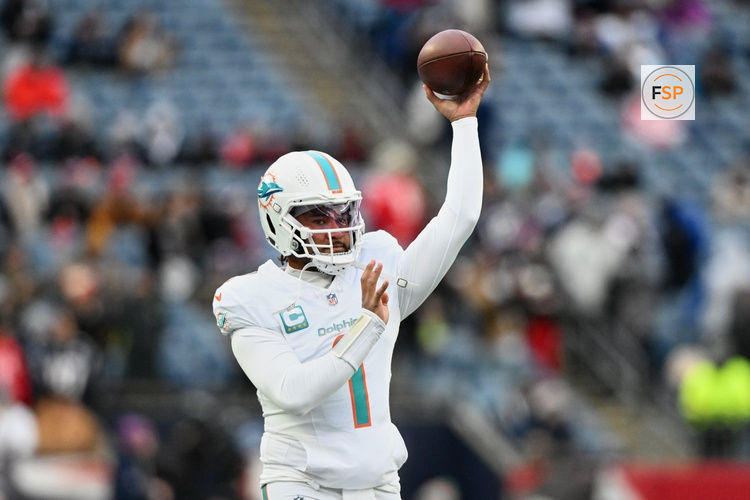Jan 4, 2026; Foxborough, Massachusetts, USA; Miami Dolphins quarterback Tua Tagovailoa (1) throws a pass before the game against the New England Patriots at Gillette Stadium. Credit: Brian Fluharty-Imagn Images