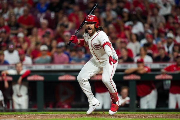 Aug 4, 2026; Cincinnati, Ohio, USA;  Cincinnati Reds designated hitter Eugenio Suarez reacts to first baseman Sal Stewart after a wild pitch against the Athletics in the eighth inning at Great American Ball Park. Mandatory Credit: Aaron Doster-Imagn Images