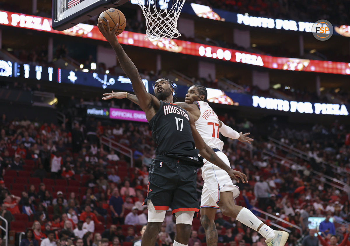 Nov 15, 2024; Houston, Texas, USA; Houston Rockets forward Tari Eason (17) shoots the ball as Los Angeles Clippers guard Kevin Porter Jr. (77) defends during the fourth quarter at Toyota Center. Credit: Troy Taormina-Imagn Images