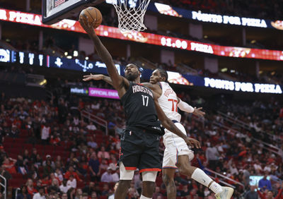 Nov 15, 2024; Houston, Texas, USA; Houston Rockets forward Tari Eason (17) shoots the ball as Los Angeles Clippers guard Kevin Porter Jr. (77) defends during the fourth quarter at Toyota Center. Mandatory Credit: Troy Taormina-Imagn Images