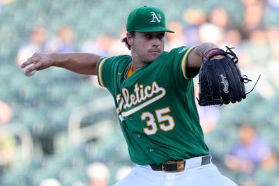 Aug 26, 2026; West Sacramento, California, USA;  Athletics starting pitcher J.T. Ginn (35) throws a pitch against the Minnesota Twins during the first inning at Sutter Health Park.  Mandatory Credit: Dennis Lee-Imagn Images