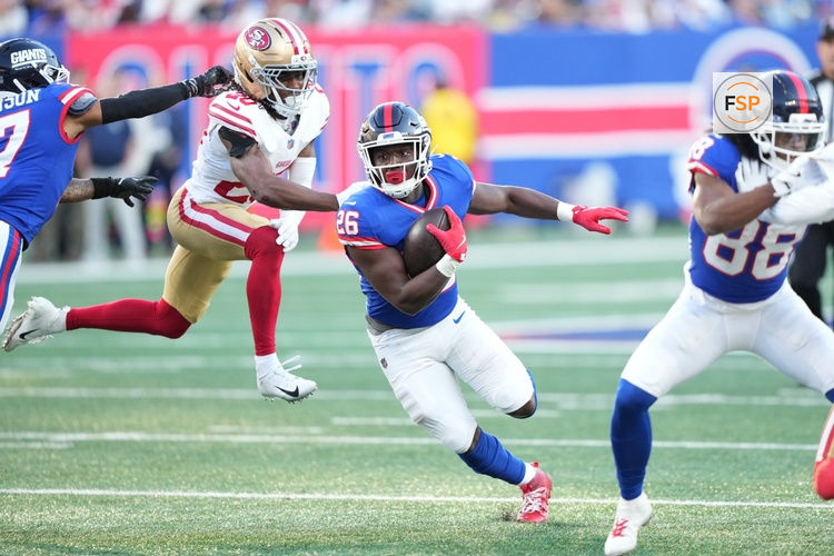 Nov 2, 2025; East Rutherford, New Jersey, USA; New York Giants running back Devin Singletary (26) carries the ball as San Francisco 49ers cornerback Upton Stout (20) pursues during the second half at MetLife Stadium. Credit: Robert Deutsch-Imagn Images