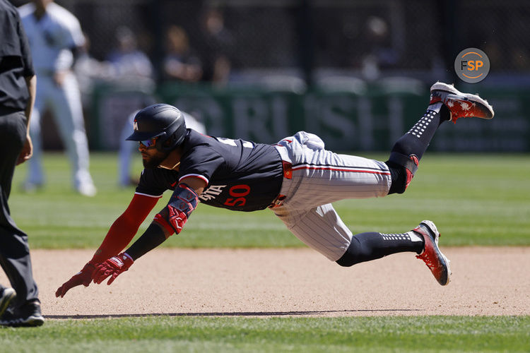 CHICAGO, IL - MAY 01: Minnesota Twins outfielder Willi Castro (50) slides safely at second base with a double in the ninth inning of an MLB game against the Chicago White Sox on May 01, 2024 at Guaranteed Rate Field in Chicago, Illinois. (Photo by Joe Robbins/Icon Sportswire)